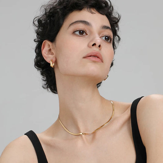 Minimalist snake chain choker Necklace waterproof displayed on a model with short curly hair, showcasing its elegant design.