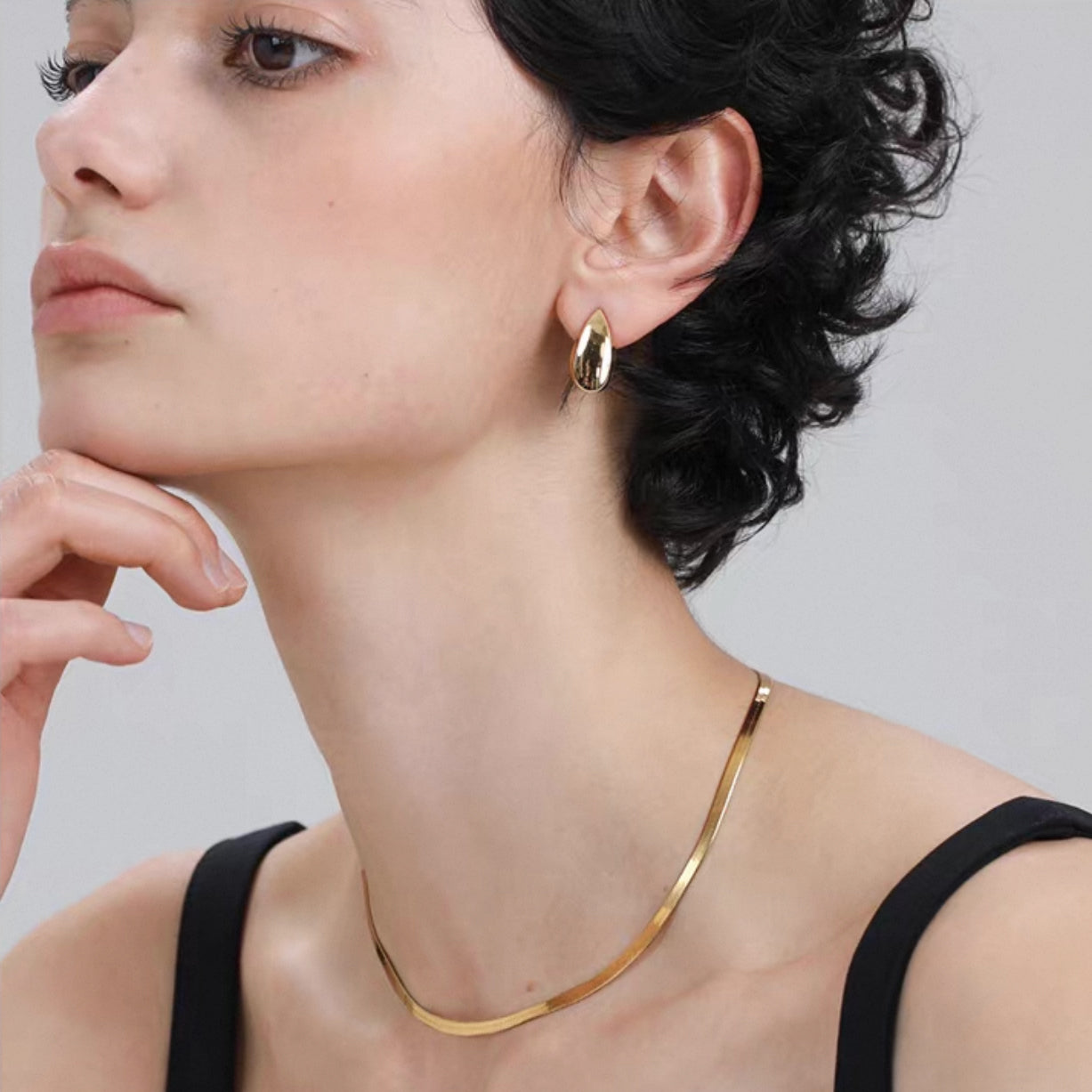 Minimalist Snake Chain Choker Necklace waterproof worn by model with elegant hairstyle and gold earrings.